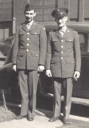 US Army enlisted men wear the class A service uniform.