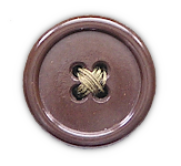 A flat, plastic, American style button used on the exposed areas of the wool jacket shown below.  These were located on the shoulder loops, waistband, and cuffs so that Americans could be distinguished from Commonwealth troops.  This type of button was approximately 19 mm across.