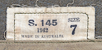 Label located on the inside, rear of the garrison cap showing the manufacturer, year, and size.  The S indicates the cap was made in the state of South Australia. Most Australian made enlisted men's clothing had a similar label.