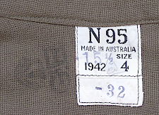 Label located on the inside nape area of the enlisted man's knit wool shirt shown above.  The N indicates it was made in the state of New South Wales. This label shows the U.S. size 15½ X 32 as well as the Commonwealth size 4. The initials G.E. and Broad Arrow are an inspector's mark. Note the knit fabric which differed considerably from the standard American made flannel shirt.