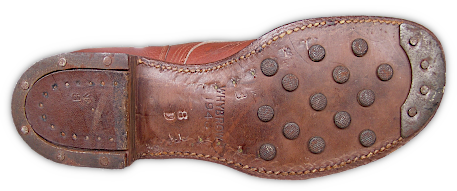 The full leather outsole of the Australian made hobnail service shoes showing the hobnails, steel rimmed heel, and steel toe tap.  Regular service shoes were also made in Australia during WW2 as part of the reverse lend lease program.