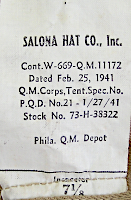 Contractor's label attached to the khaki cotton field hat shown to the left.  Labels were located in the rear of the hat sewn into the sweatband seam.  The khaki field hat was procured for only a short period of time beginning 25 February 1941 and ending 16 May 1941.  Despite its short life, the hat became quite popular with troops because it was washable and foldable, which were desirable characteristics for field use.  Because of its success, a similar herringbone twill hat was made for wear with the two‐piece herringbone twill suit.