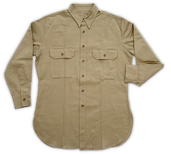 Front view of the enlisted men's 8.2‐ounce khaki cotton shirt (specification QMC 6‐241, 29 November 1938).  Approved as a standard article of uniform on 19 April 1938, this shirt was to be worn as an outer garment replacing the khaki cotton service coat and oxford cloth shirt ensemble then in use.   In tropical climates, the 8.2‐ounce fabric and long sleeves provided adequate protection against insects and brush and was a cooler alternative to the coat and shirt combination.