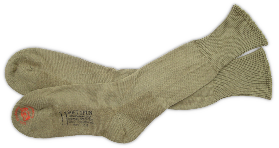 Olive‐drab cushion sole socks (specification PQD 236, August 1942).  In 1942, socks comprised of a 50% wool and 50% cotton blend were introduced that featured a cushion sole designed to keep the feet dry and comfortable while in the field.  Initially, cushion sole socks were made in both olive‐drab and gray, but by 1943 were predominately olive‐drab.  Cushion sole socks became standard issue for all branches of service during WW2 and underwent continual improvements in material composition, water repellency, and shrink resistance.