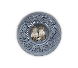 Close‐up view of the trouser waistband button. Pre‐war khaki trousers had dished buttons made from zinc and were stamped "U.S. Army" on the front.  There was one 27‐ligne waistband button and four 22‐ligne fly buttons. Beginning in 1942, buttons for khaki trousers were made of plastic.