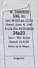 Contractor's label for the khaki cotton trousers shown to the left and right.  The label was attached to the right, front pocket on the side facing the khaki fabric.   W. Shanhouse & sons of Rockford Illinois was awarded contract number 12226 in June 1941 for $85,000.  The contract was completed in January 1942.