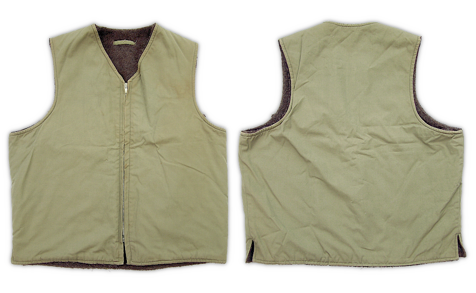 Front and back views of the split hem alpaca pile vest adopted by the Marine Corps during WW2.  There were three versions of the USMC vest ‐ one with a button‐up front, one with a zip‐up front and split hem, and one with a zip-up front and solid hem.  The vest pictured here is believed to be the second type issued.