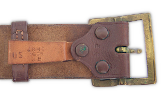 Underside view of the buckle area of the enlisted man's leather belt shown above. Visible are the three pressure snaps used to hold the buckle and loop keeper in place. The date of manufacture, in this case 1939, was pressed into the keeper along with the initials of the purchasing depot and inspector. The size was marked on the middle snap.