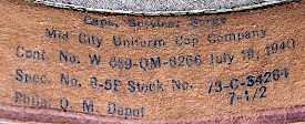 Contractor's label printed inside the service cap shown to the left. The label was stamped in ink on the reverse side of the leather sweatband. Contract number 8266 was awarded to Mid‐City Uniform cap company of Chicago on 19 July 1940 for $74,000. The contract was completed in November of that year. Mid‐City made millions of dollars in headgear for the Army and Marines during the World War 2 years.