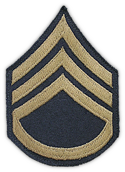 Close‐up view of embroidered staff sergeant chevrons (third grade). Another type of chevron worn on the wool uniform consisted of grade insignia embroidered on a dark blue wool background. As World War 2 progressed, embroidered chevrons became the most common type worn. Toward the end of 1942, a new symbol "T" was added to the insignia of grade which meant technician and was placed either under the chevrons or in the space between the chevrons and arc as appropriate for grade.