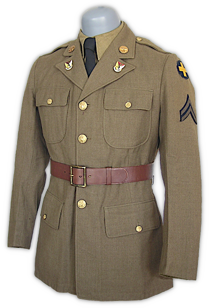 Display showing the M‐1939 wool service coat, flannel shirt, black wool necktie, and leather belt worn together. Smart, good looking, and presenting a nice mixture of traditional and modern design elements, this ensemble was, unfortunately, short lived. Conservation pressures and the development of a dedicated field jacket made some of its features unnecessary. In the spring of 1941, the belt was eliminated to conserve leather and brass. Once the leather belt was withdrawn from issue, new coats were produced without belt hooks and sometimes removed from older coats. In the summer of 1942, the coat, no longer used in the field, would lose its pleated back and bellows lower pockets, and the black necktie would be changed to khaki shade no. 5.