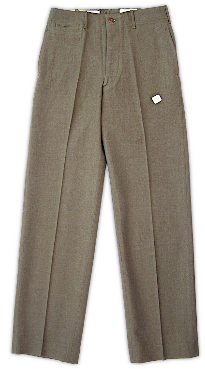 Front view of the enlisted man's wool trousers (Specification QMC 8‐83B, 9 November 1937). Wool trousers were full length with a button fly, seven belt loops, an integral waistband, two rear pockets, two hip pockets, and a front watch pocket on the right side. Three classes of trousers were produced: Class A, 18‐ounce serge wool in olive‐drab 32 "light shade" ; Class B, 18‐ounce elastique in olive‐drab 32 "light shade" ; and Class C, 20‐ounce suiting in olive‐drab shade 33. Shown here are Class A trousers, which were produced in far greater numbers than the other classes.